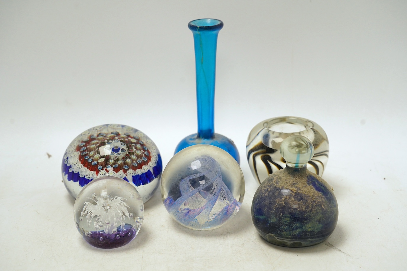 A group of glass paperweights, a vase and pin tray; Mdina, Murano, Isle of Wight etc. Condition - good